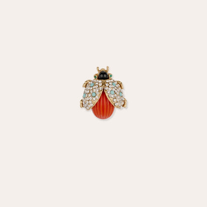 Broche de mariquita dorada
